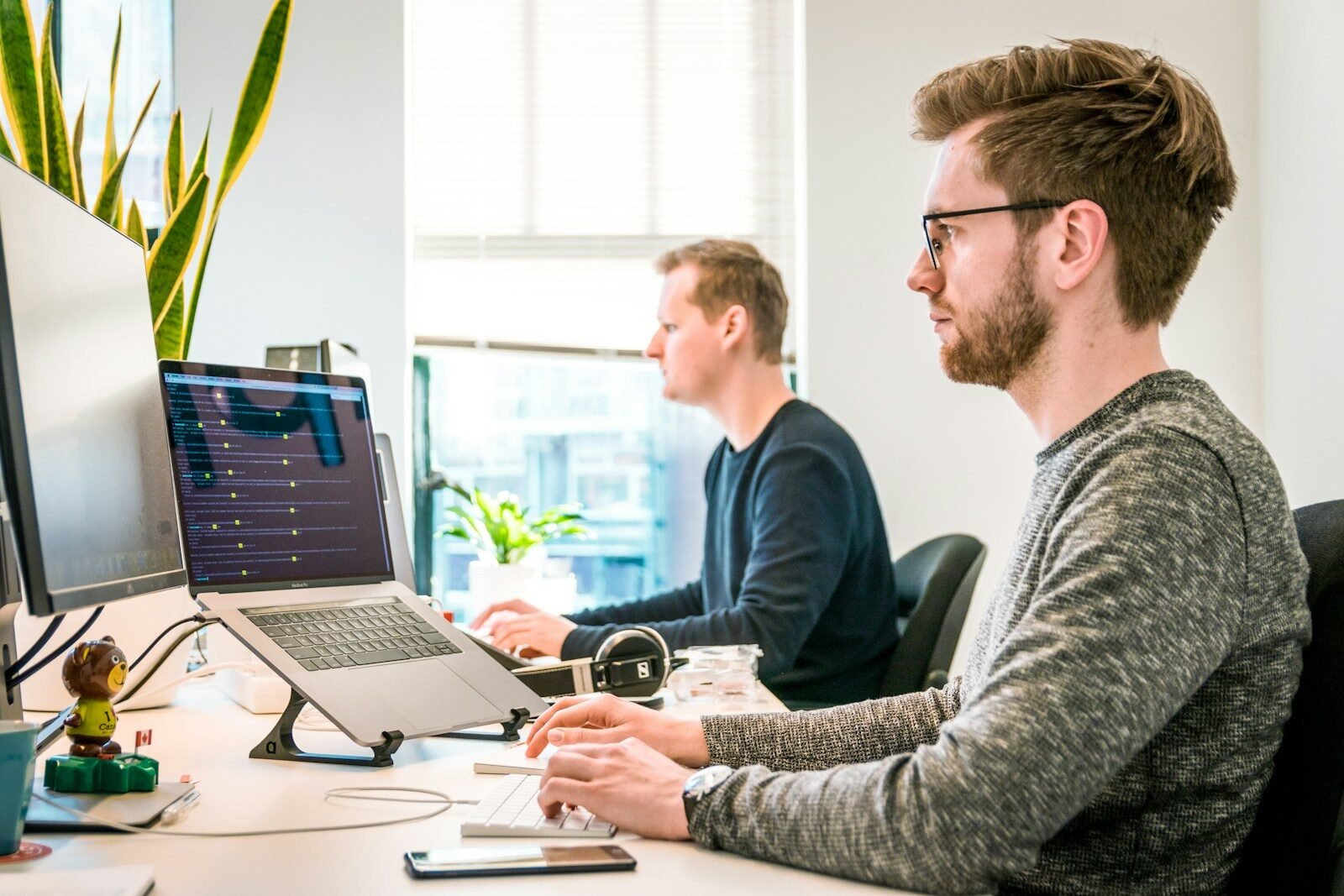 Best Zapier alternatives for agencies - team working in office
